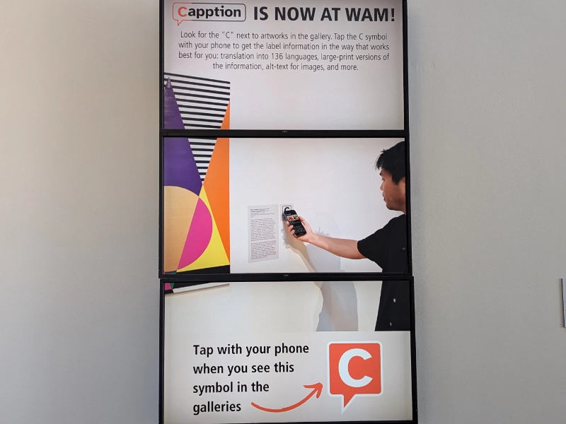 A Weisman Art Museum display explains how visitors can use Capption in the galleries