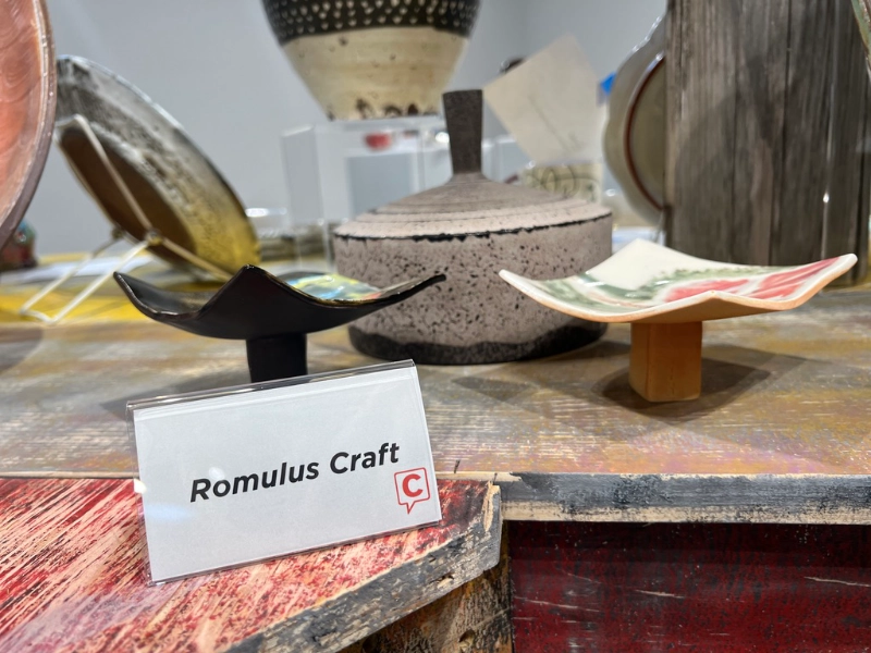 A Capption indicator beside pottery by Romulus Craft