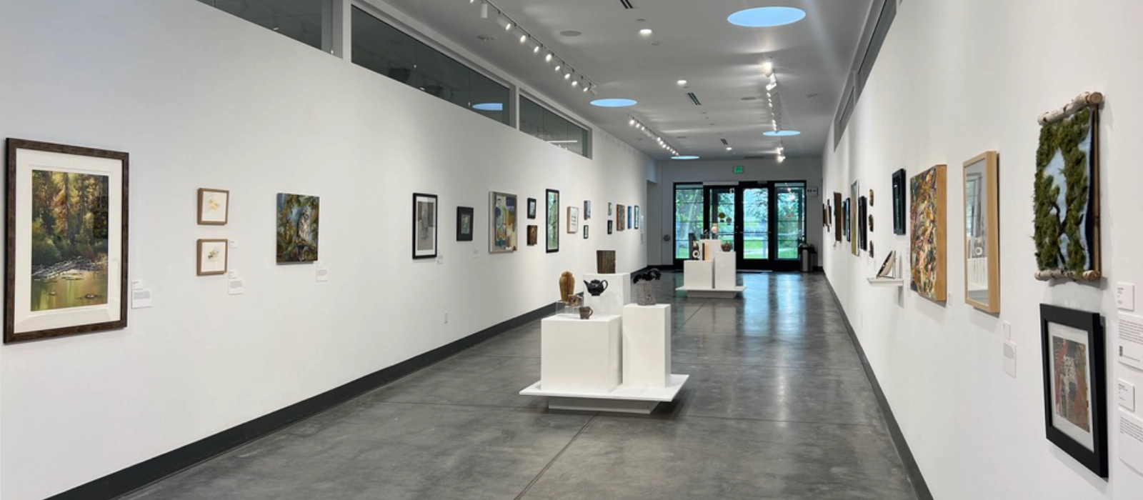 Artwork displayed in a bright gallery at White Bear Center for the Arts
