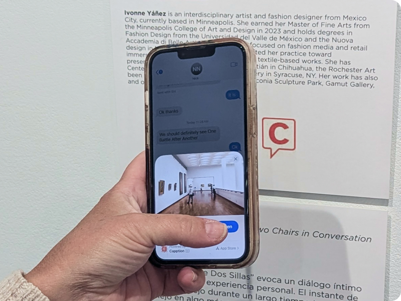Visitor using a phone to learn about an exhibit